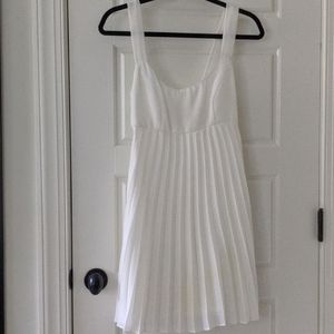 Vintage white babydoll dress with pleated skirt